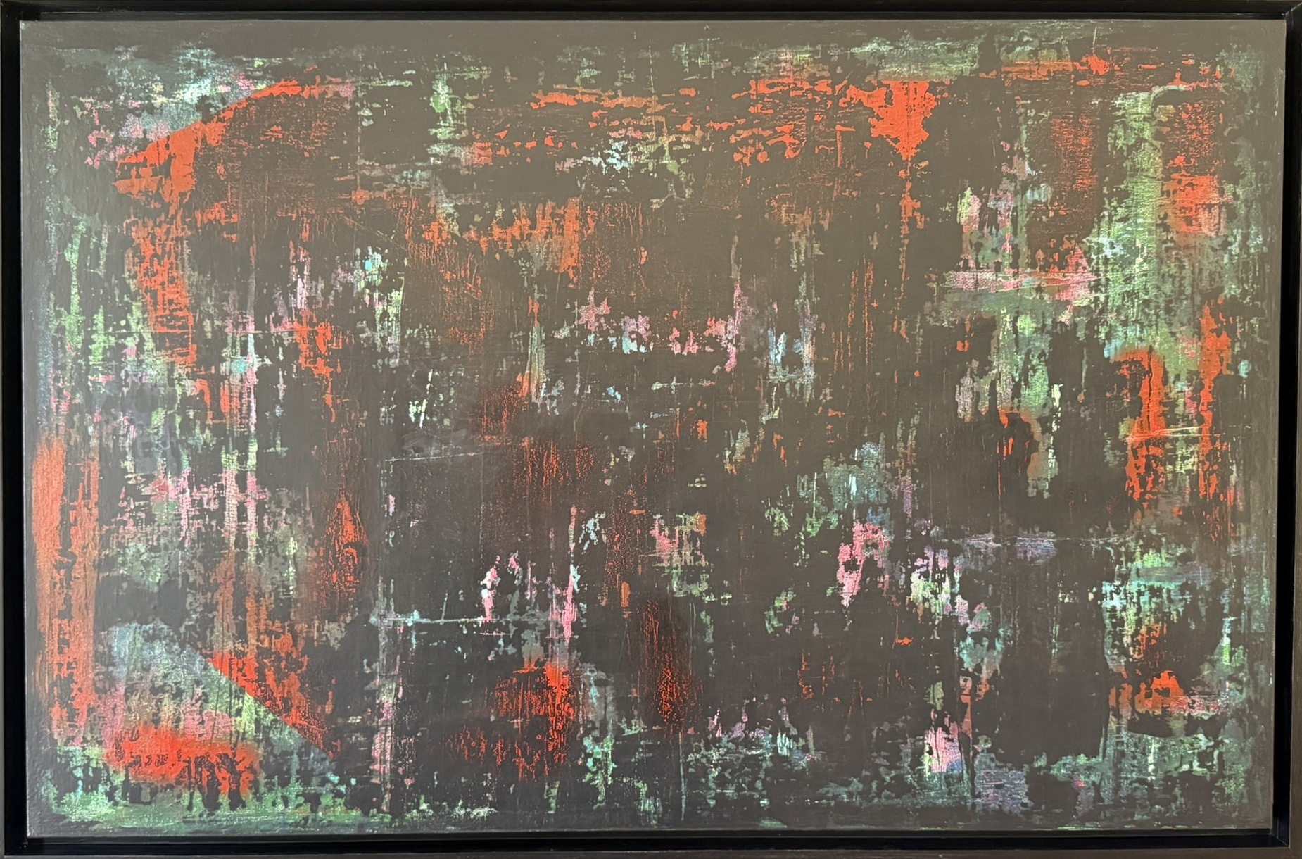 Abstract painting in dark tones with red and orange, black frame